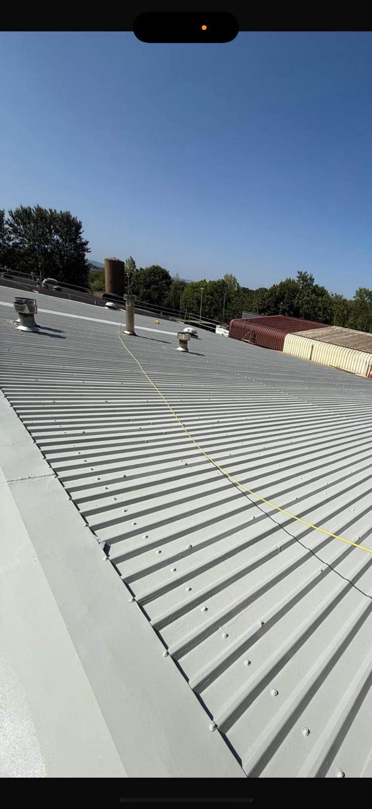 Ageing commercial roofs with coating system